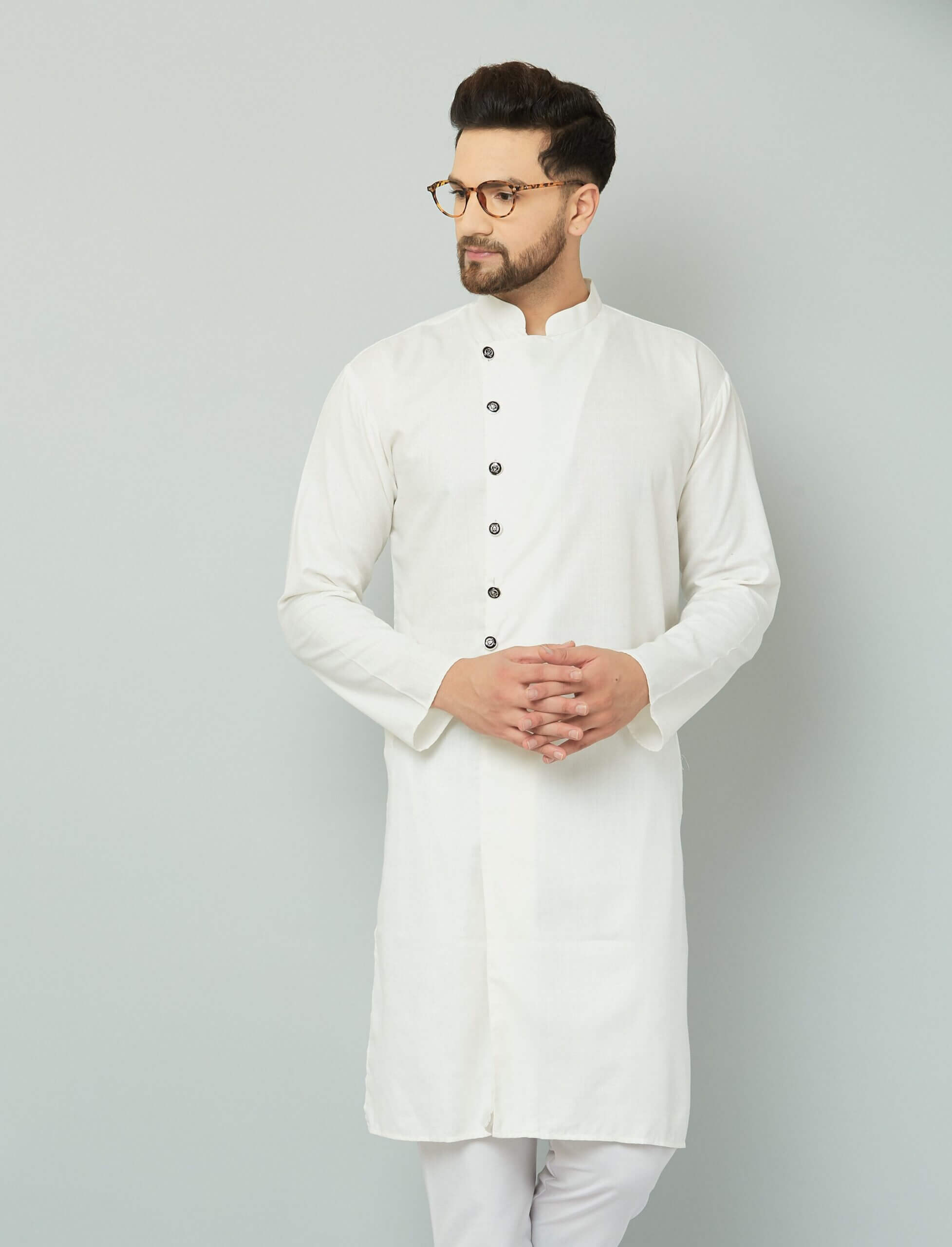 Stylish Assymetric Sherwani Style Kurta White cotton kurta with black buttons.