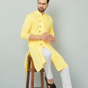 Traditional Indian yellow cotton kurta set.