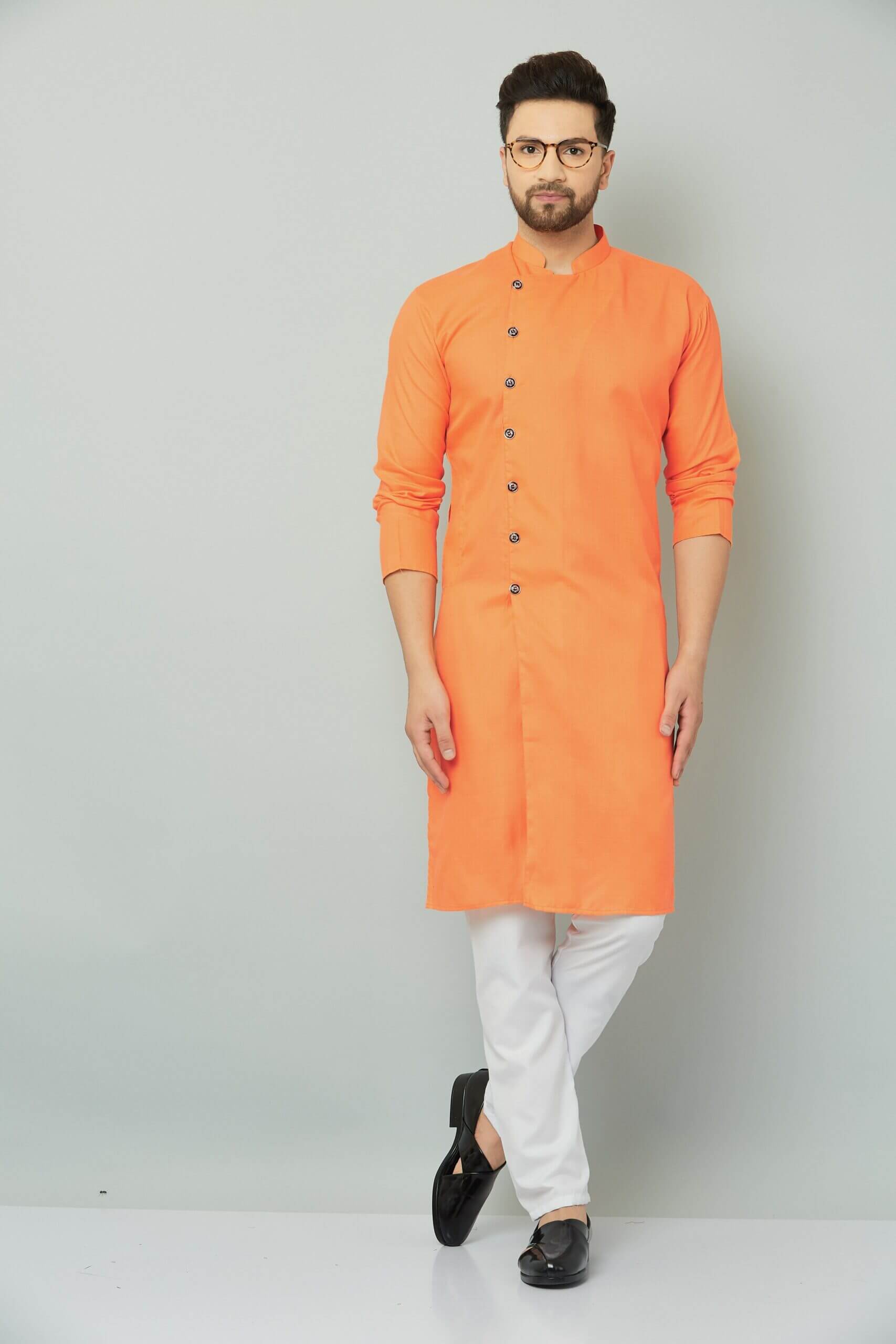 p (4)-min Traditional Indian orange kurta with intricate embroidery.
